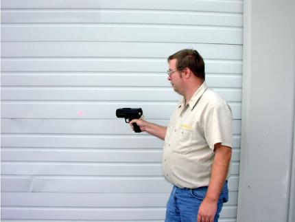 Man shooting laser on to wall